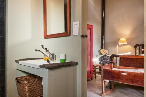 a bathroom with a sink and a bath tub at La Madrigata al completo in Revilla de Cepeda