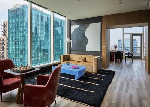 a living room with a couch and a table at Lux Apts with Lake Views and Top Amenities in Chicago