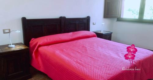 Residenza Locci - Rooms & Apartmentsにあるベッド