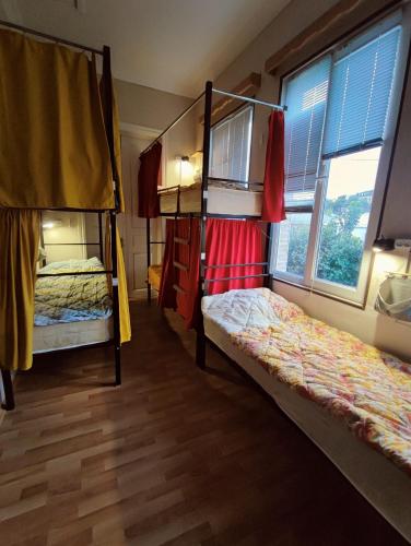 Postel nebo postele na pokoji v ubytování The Friends Hostel