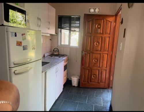 a kitchen with a refrigerator and a counter top at CERCA DEL MAR - Costa Azul in Costa Azul
