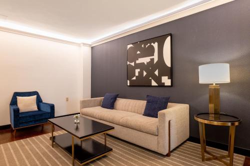 a living room with a couch and a chair at Eurostars St Gregory Dupont Circle Georgetown in Washington