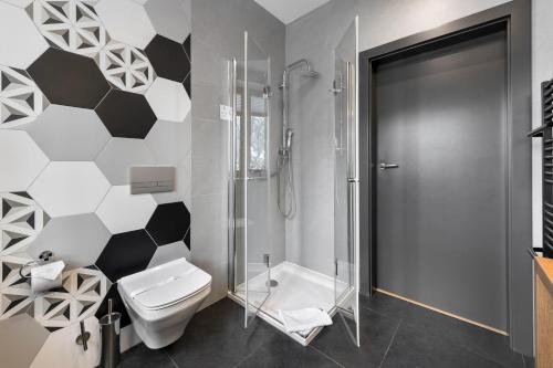 a bathroom with a toilet and a shower at WILLA JAROSTA & SPA, AC -free parking in Zakopane