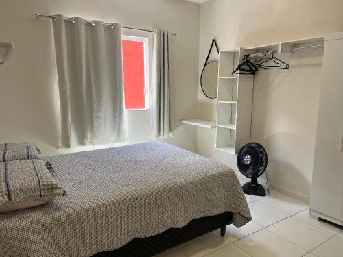 Ένα ή περισσότερα κρεβάτια σε δωμάτιο στο Conforto e Praticidade – Próx. ao Aeroporto e Hospital
