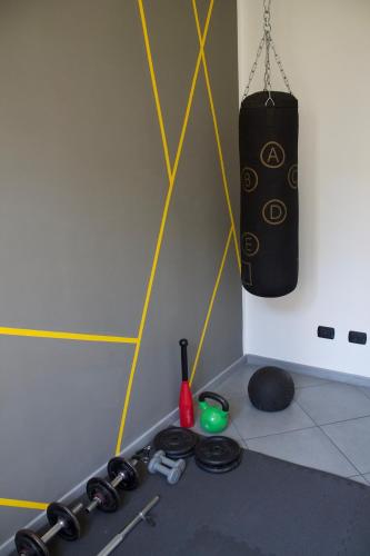 a room with a punching bag hanging from a wall at MM HOUSE Lainate modern design near Rho Fiera in Lainate