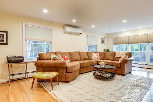 a living room with a couch and a table at Near Main St and Festivals Peaceful Keene Getaway! in Keene