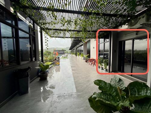 an empty hallway with plants in a building at GrandWara Khao Yai แกรนด์วารา เขาใหญ่ in Ban Nong Song Hong