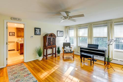 a living room with a piano and a table at Near Main St and Festivals Peaceful Keene Getaway! in Keene