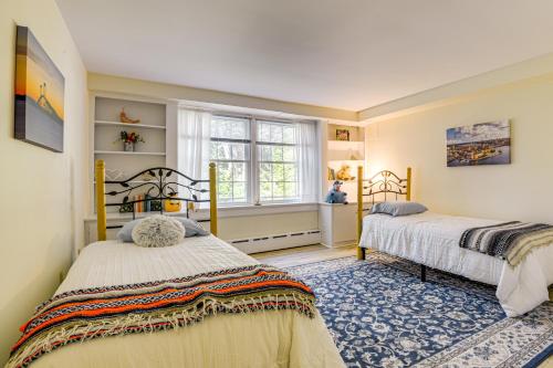 a bedroom with two beds and a window at Near Main St and Festivals Peaceful Keene Getaway! in Keene