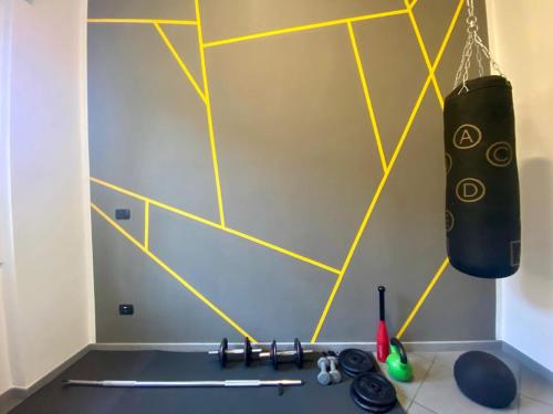 a ping pong table in a room with yellow lines at MM HOUSE Lainate modern design near Rho Fiera in Lainate