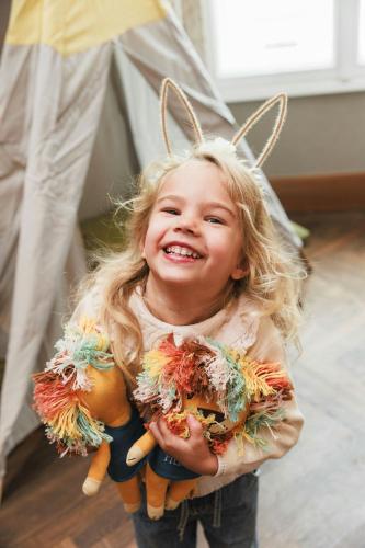 a little girl with bunny ears on her head at The Ritz-Carlton, Vienna in Vienna