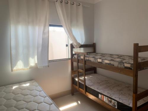 Postel nebo postele na pokoji v ubytování Linda Casa com piscina Aquecida e área de lazer