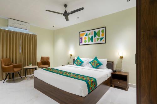 a bedroom with a large bed in a room at Treebo The Infinity, Banjara in Hyderabad