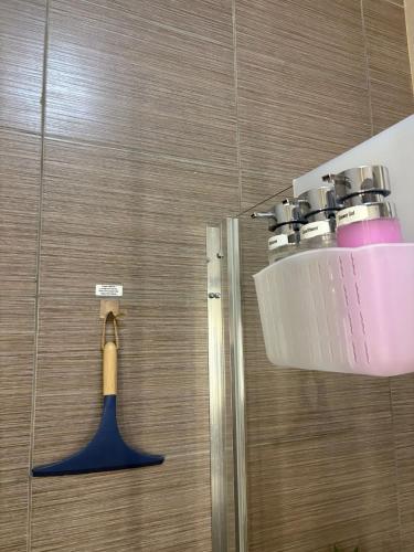 a bathroom with a sink and a toothbrush holder at The Bright Bridge, Near Sliema with AC in Il-Gżira