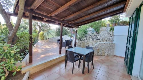 a patio with a table and chairs on it at Residence Maresol in Vieste