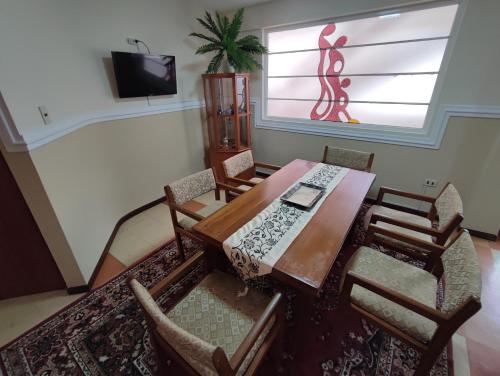 a dining room with a table and chairs at Sucre serenity Home in Sucre