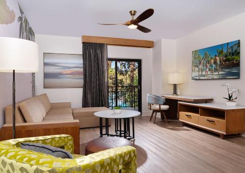 a living room with a couch and a table at Tahiti Village Resort & Spa in Las Vegas