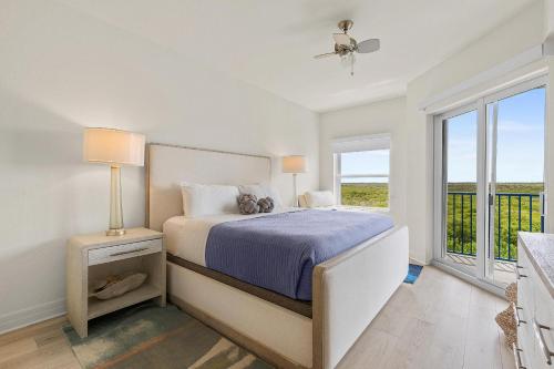 a bedroom with a bed and a window at Oceanwalk 17-502 in Chicken Island