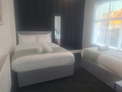Ένα ή περισσότερα κρεβάτια σε δωμάτιο στο Luxury Stays Sunderland