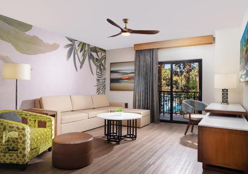a living room with a couch and a table at Tahiti Village Resort & Spa in Las Vegas