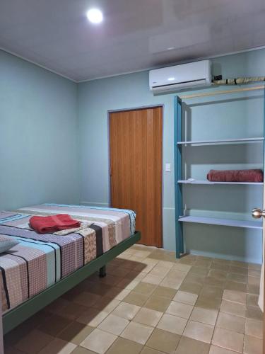 a bedroom with a bed in a room with a closet at Santos Place in Drake