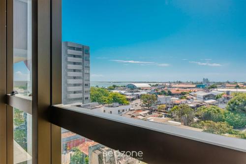 a view of a city from a window at NWTs - Estúdios em Prédio com Vista Mar in Maceió