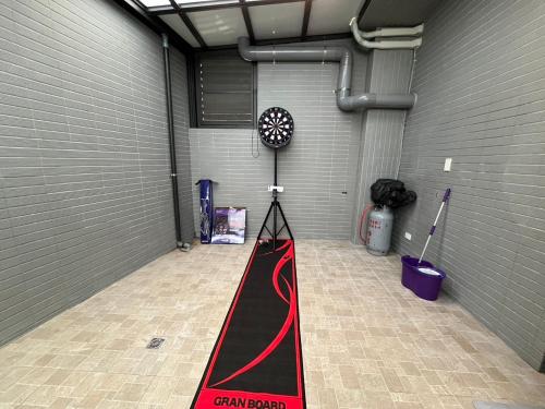 a garage with a red and black track in it at Up villa in Taibao
