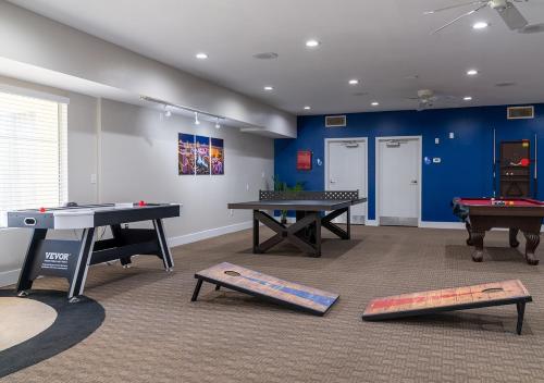 a room with two ping pong tables and pool tables at Club de Soleil All-Suite Resort in Las Vegas