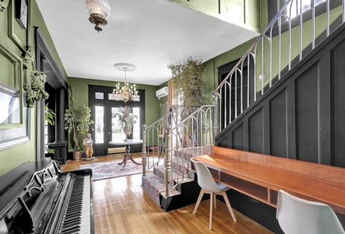 a room with a piano and a staircase with chairs at Cozy Casa Mina 1br Near Downtown Parking in El Paso