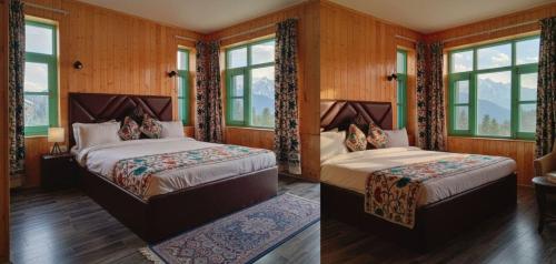 two beds in a room with windows at The Routes Pahalgam in Kolur