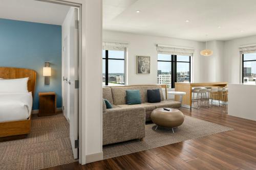 a living room with a couch and a bed at Element Minneapolis Downtown North Loop in Minneapolis