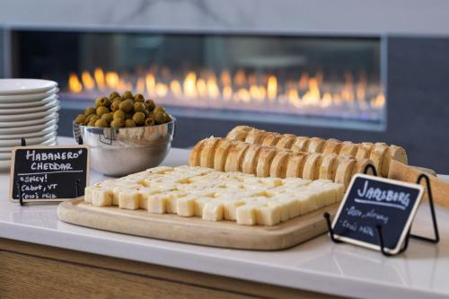 a display of food on a table in a bakery at Element Minneapolis Downtown North Loop in Minneapolis