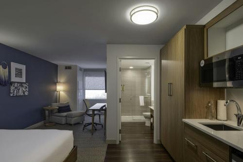 a hotel room with a bed and a kitchen at Element Colorado Springs Downtown in Colorado Springs