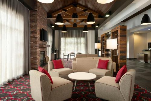 a lobby with chairs and a table and a living room at Fairfield Inn & Suites by Marriott Chattanooga in Chattanooga