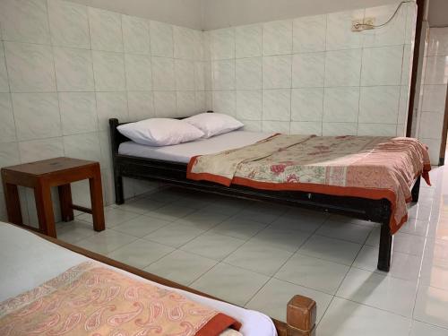 Postel nebo postele na pokoji v ubytování Hotel Sala 4 Malioboro