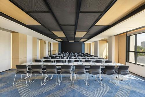 a conference room with a large table and chairs at Four Points by Sheraton Ji’an in Ji'an