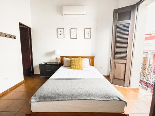 a bedroom with a large bed in a room at Old San Juan Rentals in San Juan
