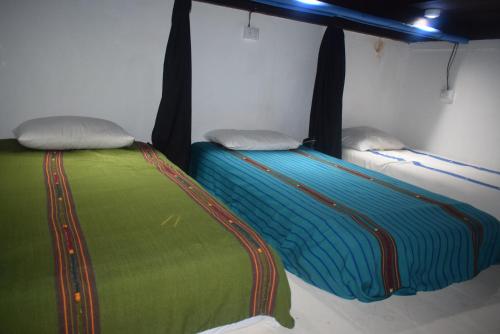 Ένα ή περισσότερα κρεβάτια σε δωμάτιο στο Hostal Antigüeño