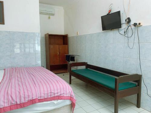 Postel nebo postele na pokoji v ubytování Hotel Sala 1 Lempuyangan