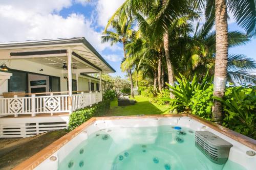 a hot tub in front of a house at Kahaone Ohana (30+ night rental) in Waialua
