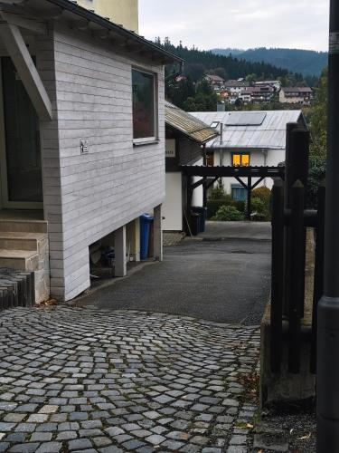 an empty street next to a building at Haus Kraus in Bayerisch Eisenstein