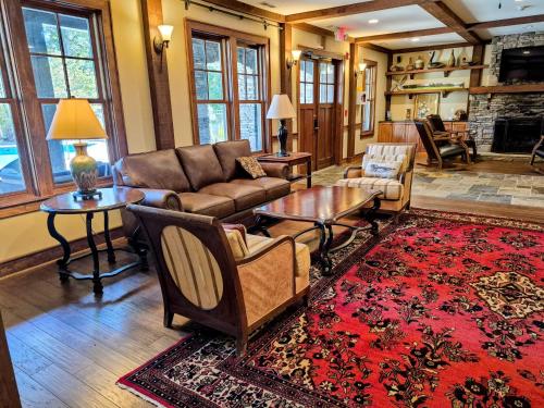a living room with a couch and a table at Firefly Cove #202 in Chimney Rock
