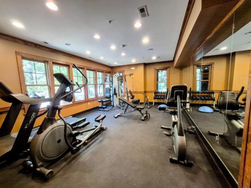 a gym with several treadmills and exercise bikes at Firefly Cove #202 in Chimney Rock
