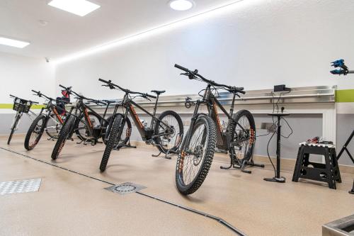 a row of bikes parked in a room at Chalet Rudana in Sesto