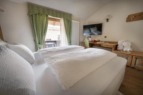 Кровать или кровати в номере Hotel Cervo