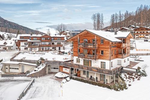 an image of a house in the snow at Chalet Rudana in Sesto