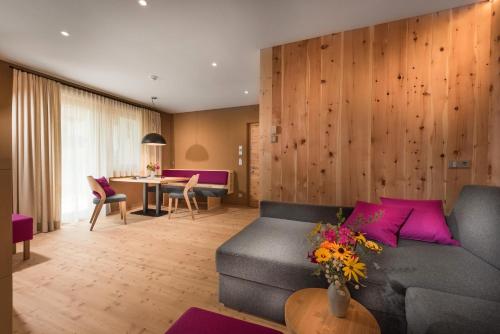 a living room with a couch and a table at Chalet Rudana in Sesto