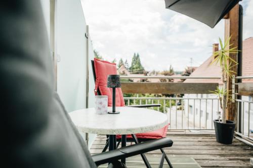 a table on a balcony with a microphone on it at Schmiedbauerhof in Sankt Margarethen im Lavanttal