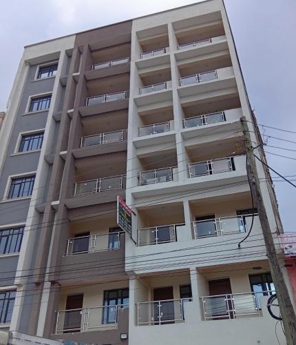 an apartment building with balconies on the side of it at JO Fully Furnished Two Bedroom in Kitengela 
