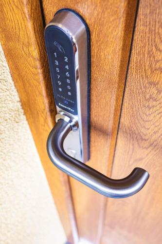 a close up of a door handle on a door at DOMEK Písařov - apartmány in Písařov
